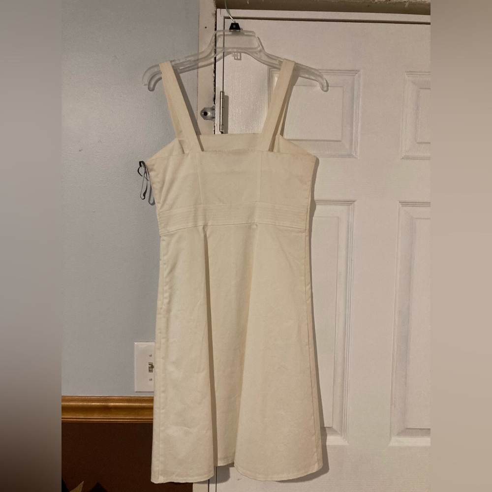 White thick strapped white dress.
